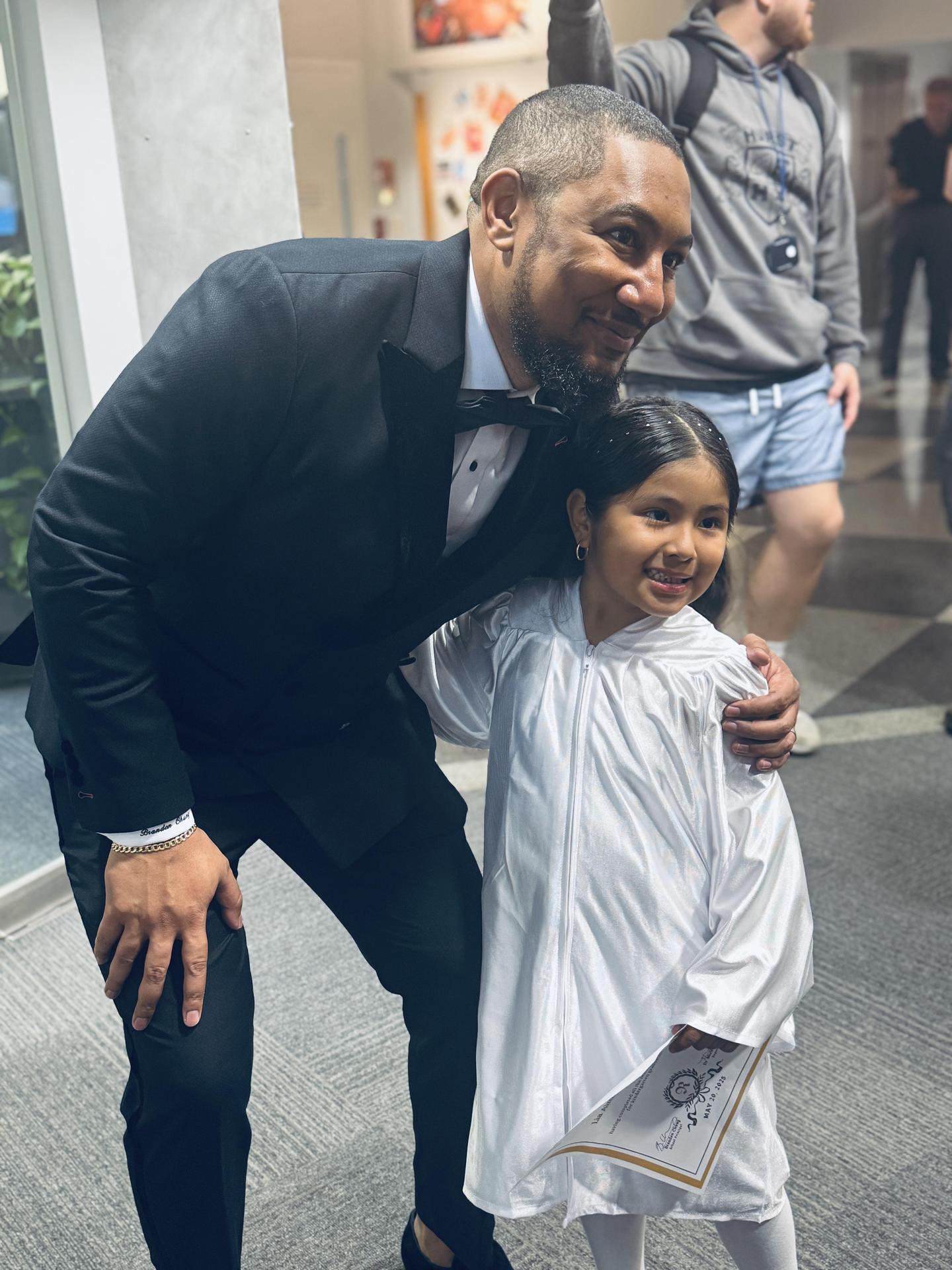 Principal Chung with kindergarten graduate