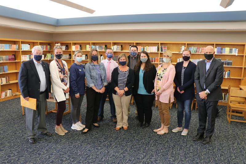 Foundation representatives and science teachers gather for a photo