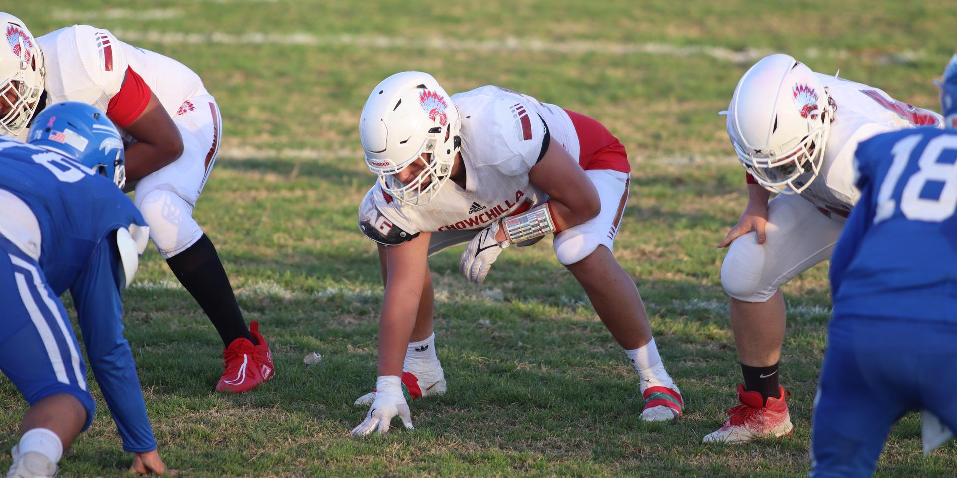 Junior Varsity football players in action against Caruthers