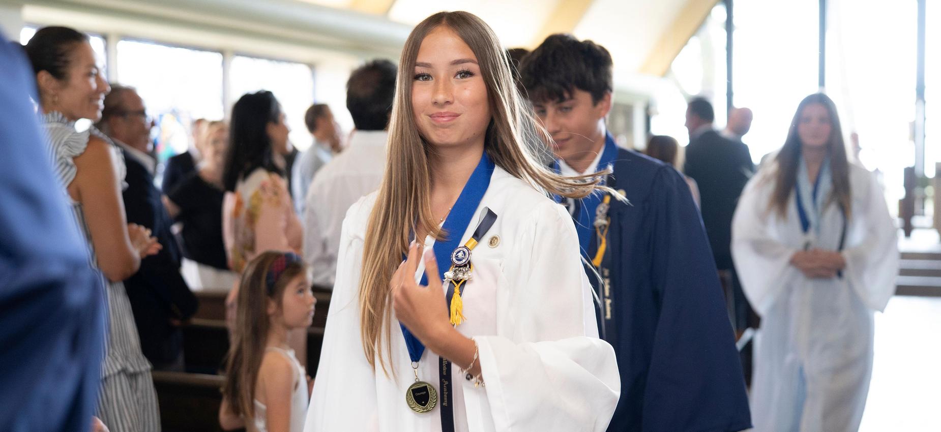 Class of 2026 poses for camera in graduation procession