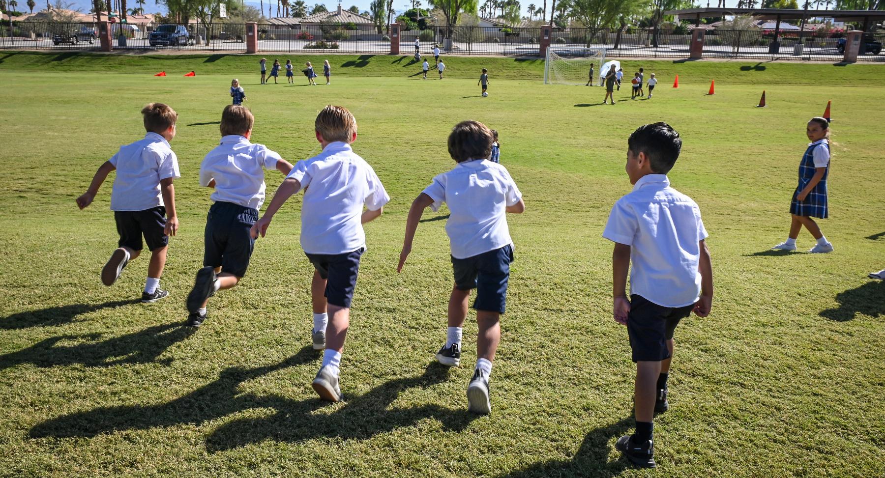 Boys running on field