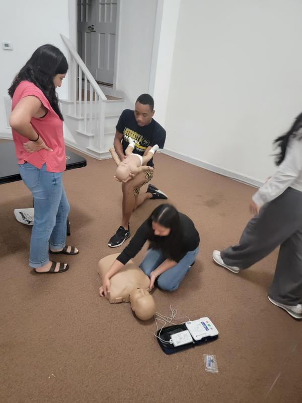 Senior students learning CPR.