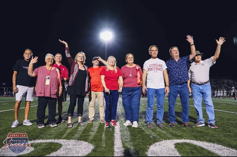 Canyon High School class of 73' group photo at a CHS football game to celebrate their 50th high school reunion.