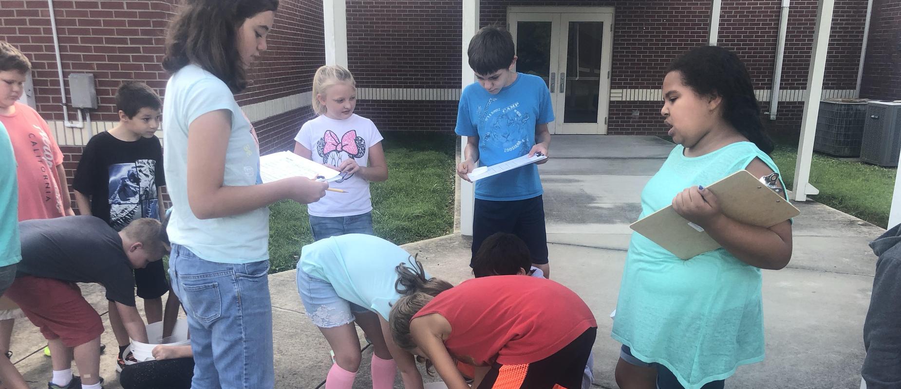 Group of students around the experiment outside