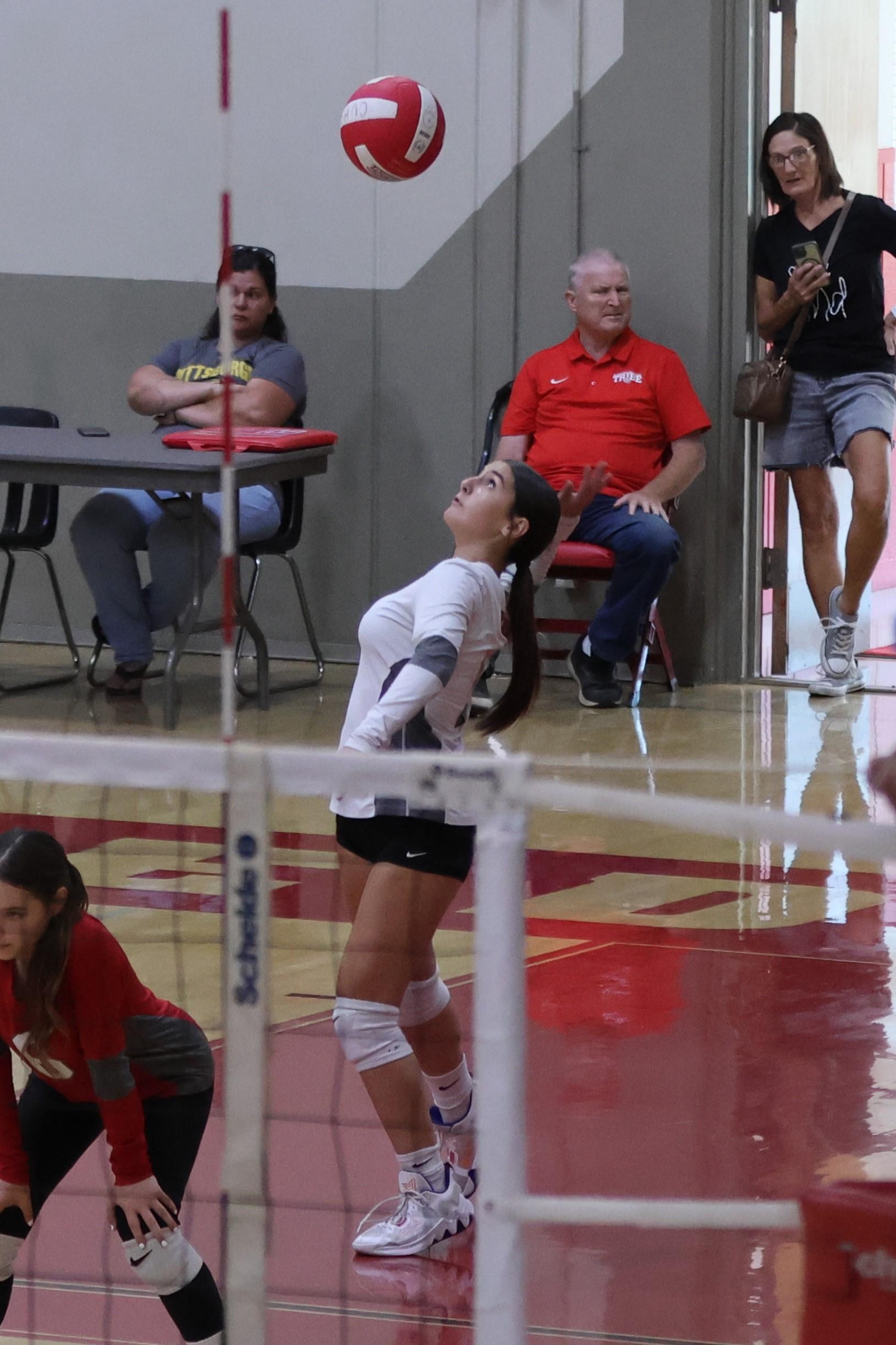 junior varsity girls playing volleyball 79