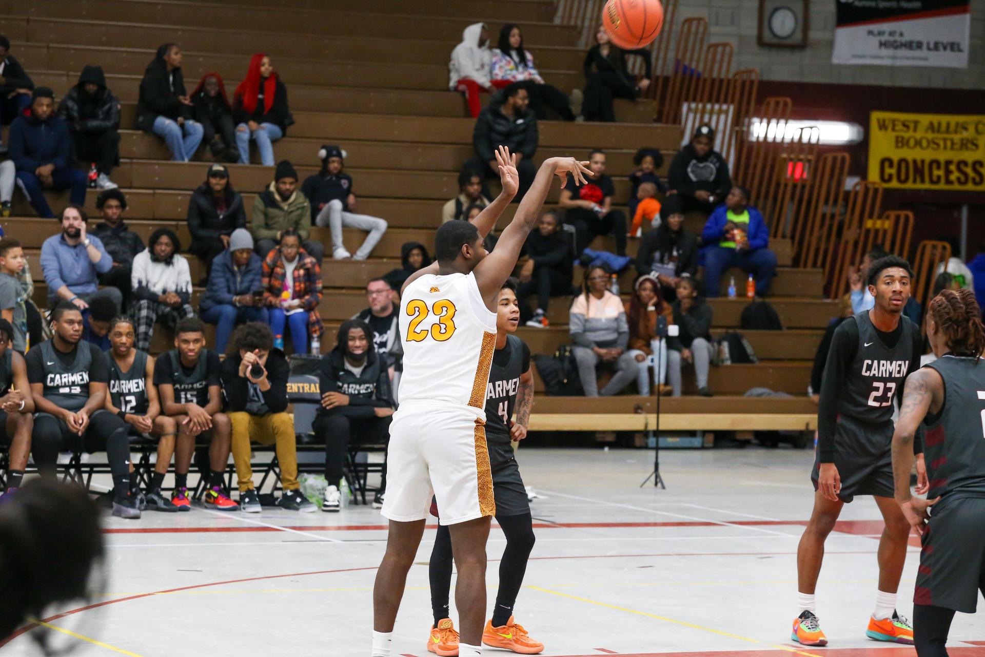 Basketball player shooting the ball in the net