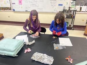 Demonstrating how rocks move through the rock cycle.