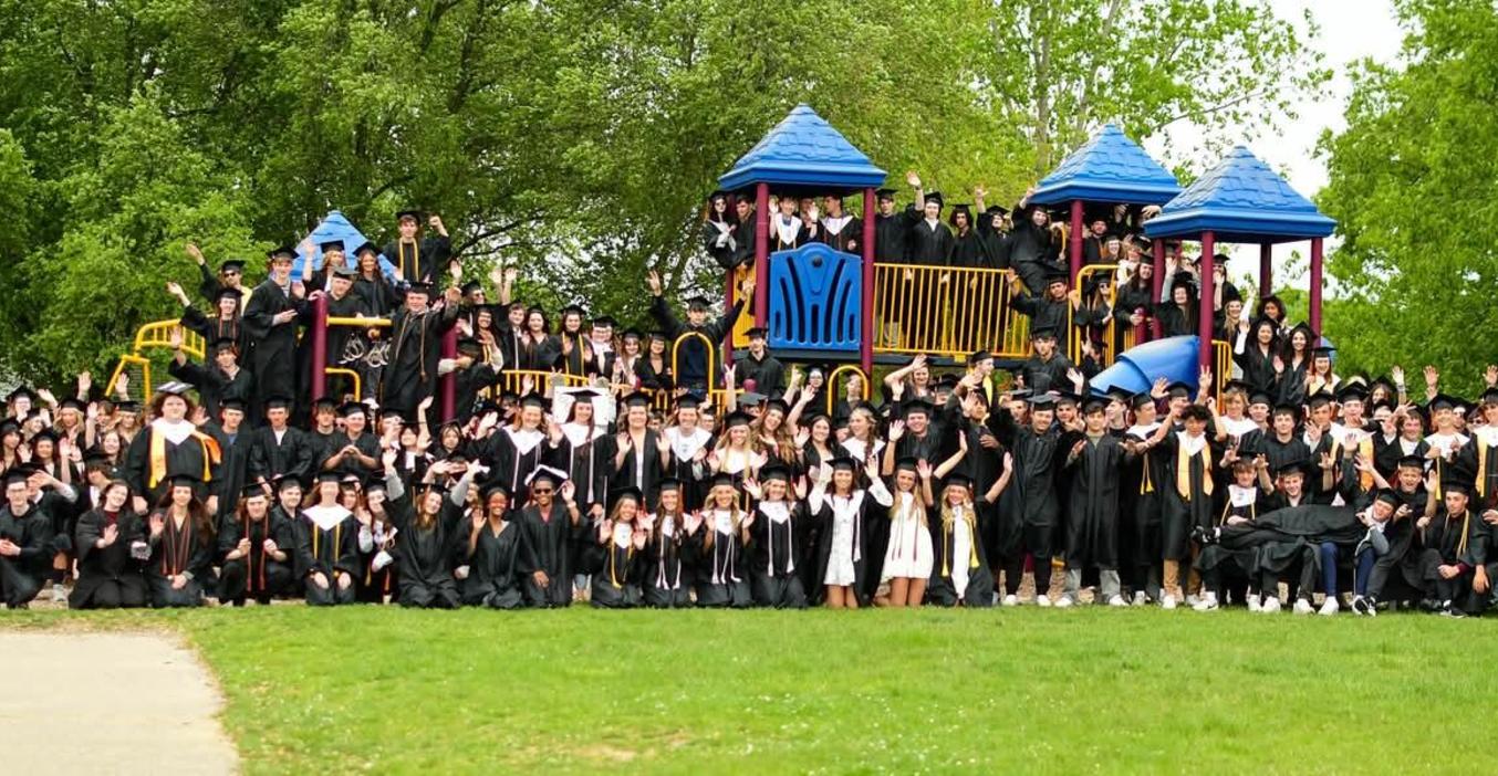 TKHS Class of 2025 poses for a photo on the Lee Elementary playground during their senior walk.