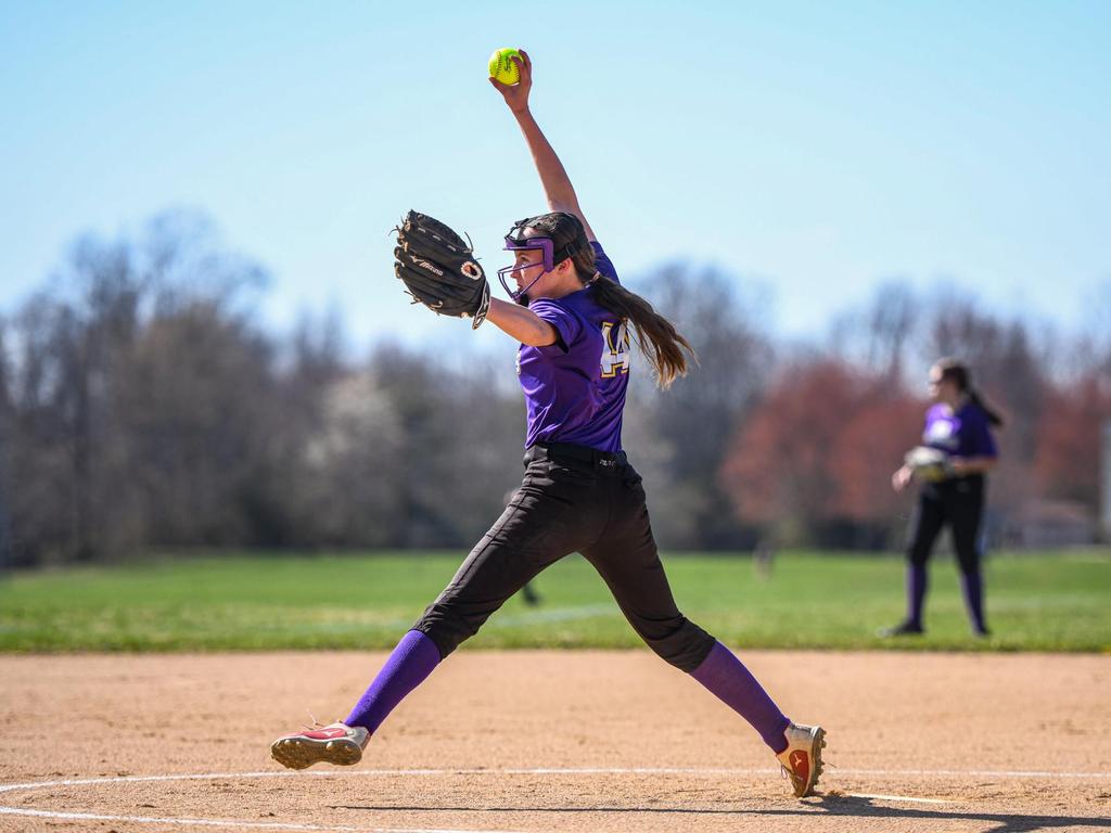 A softball pitcher throwing the ball.