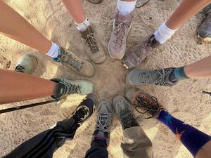 Students boots and sneakers in a circle