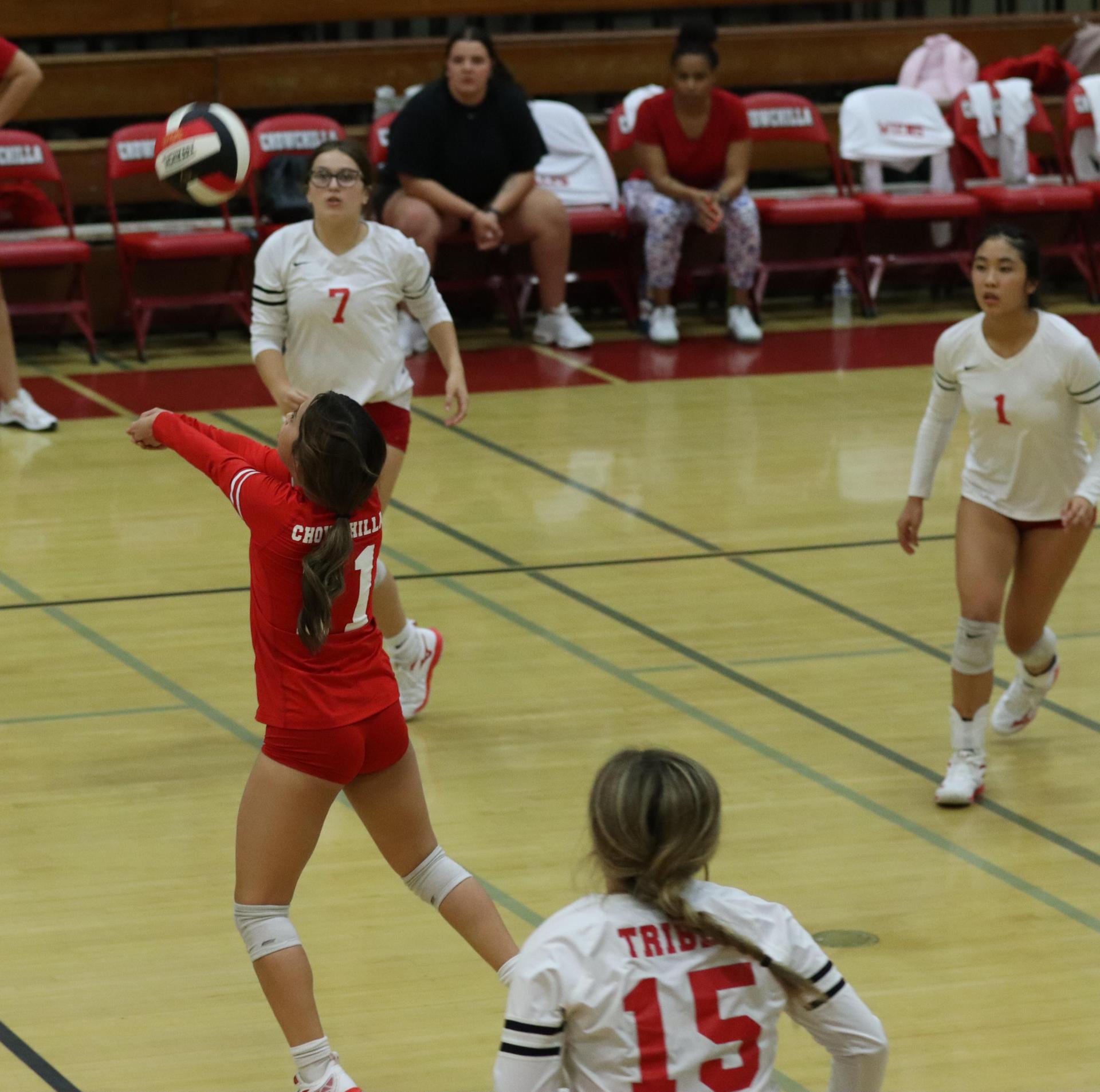 varsity volleyball players in action against golden valley