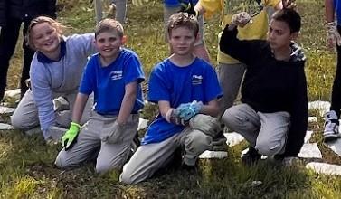 Students helping to beautify the school grounds.