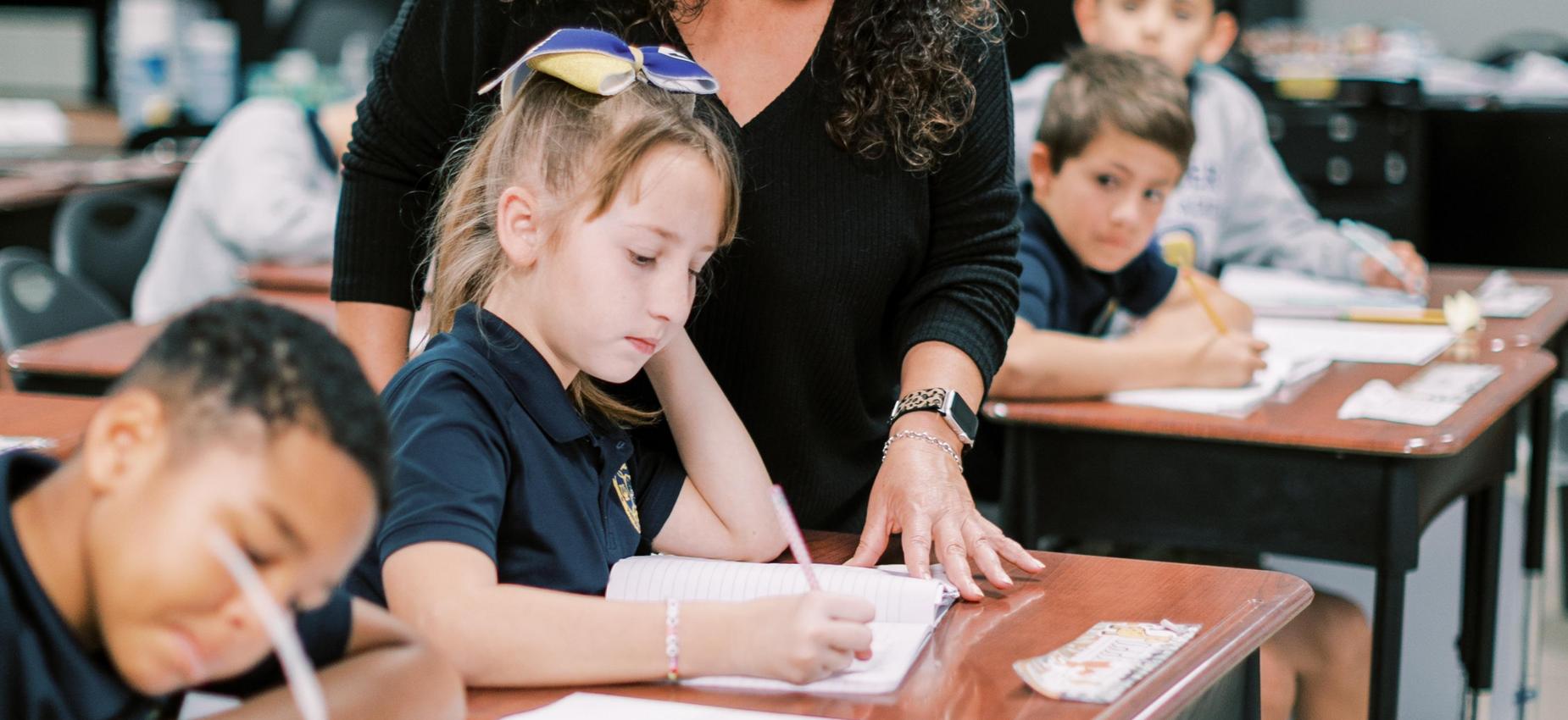 Students and teacher working in class