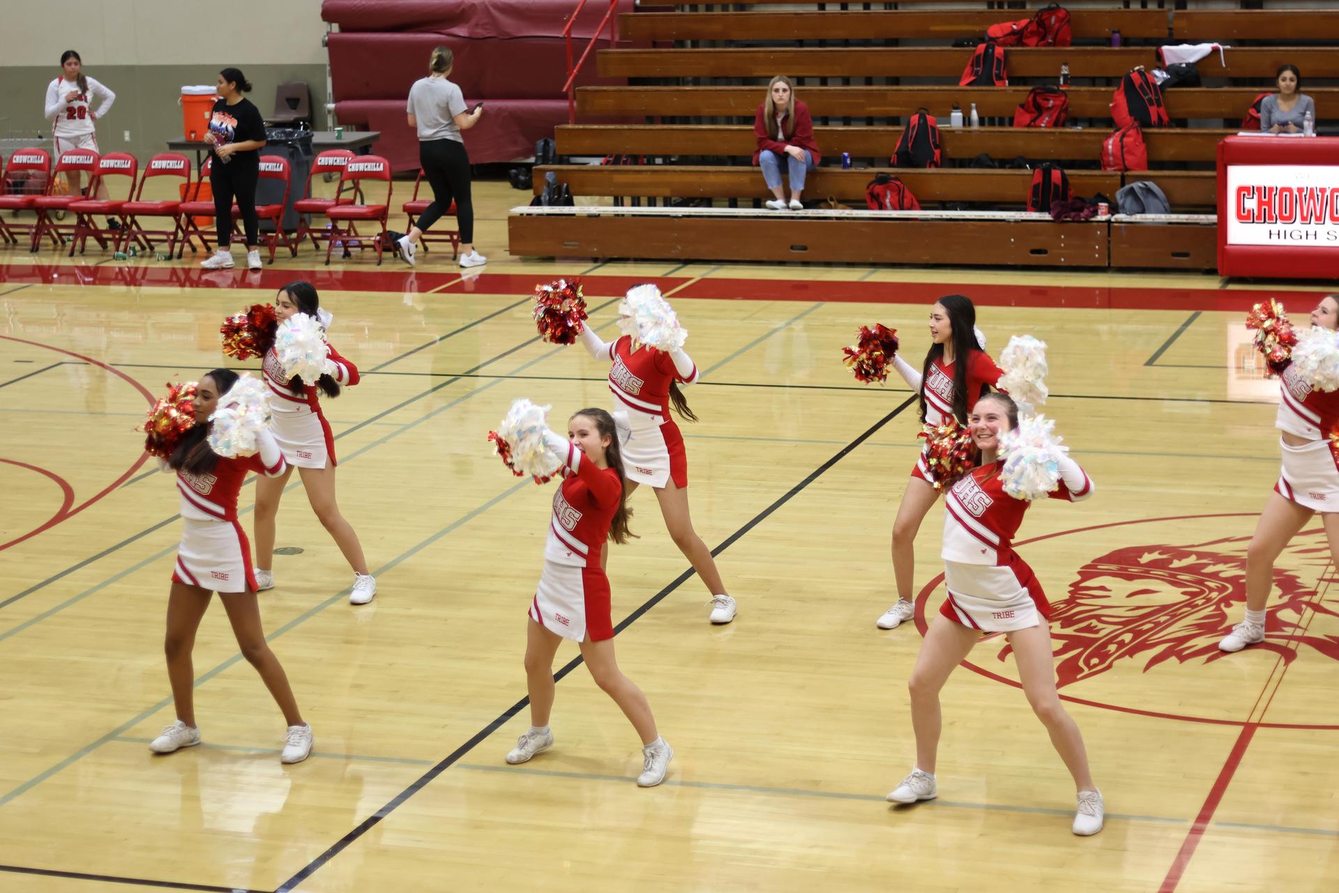 junior varsity cheerleaders cheering