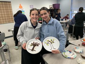 girls show off their chocolate tree