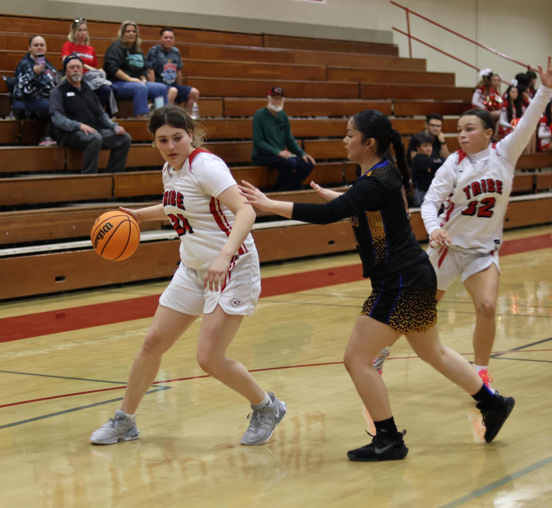 junior varsity girls playing basketball against parlier