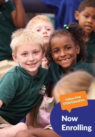 Students sitting together with the text "Tuition Free STEM Education - Now Enrolling" overlaid on image.