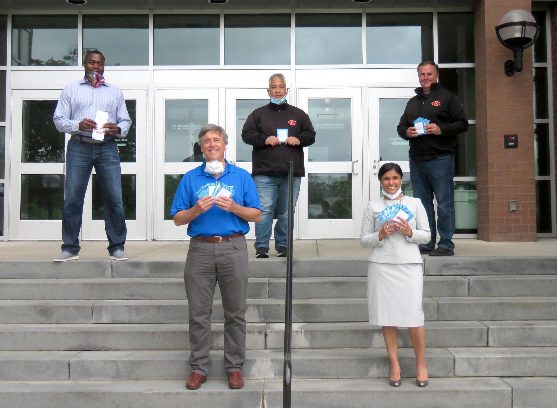 Posed photo on the steps of Everett, with educators and Everett Bank President Richard O'Neil