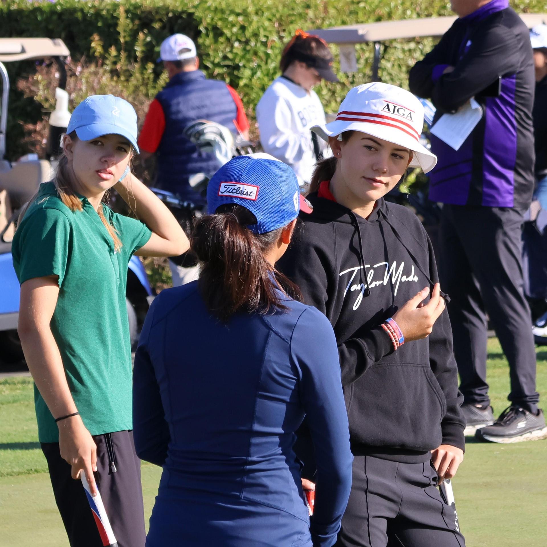 asterisk talley on the putting green before the match