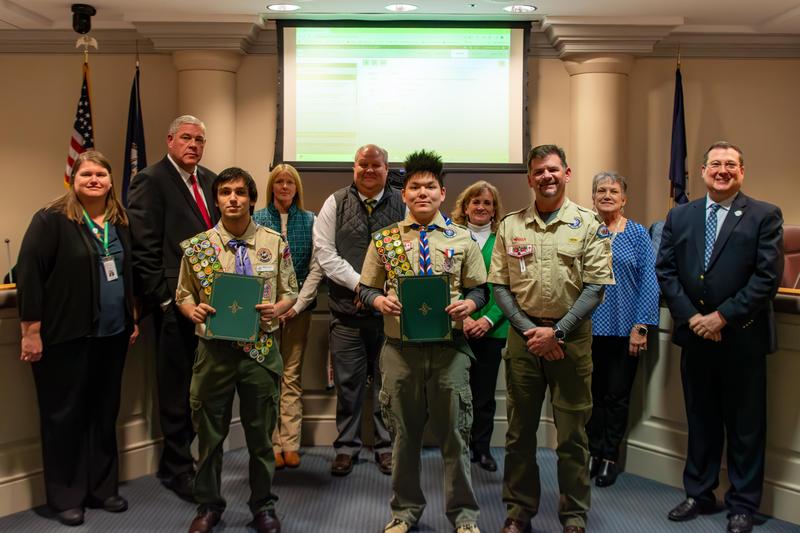 Matthew Norris and Joshua McPeak are joined by the Prince George County School Board after the pair were recognized for earning Eagle Scout within the Boy Scouts of America.