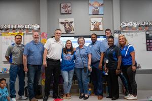 TISD administrators recognize a TIA recipient at Sampson-Howard Elementary
