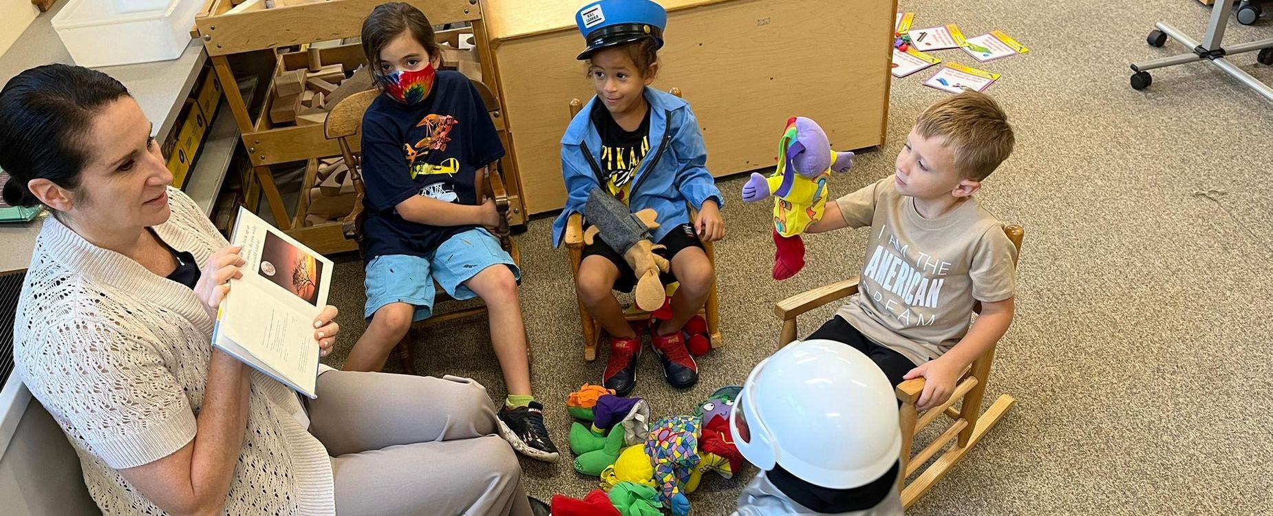 A teacher reading to elementary school students