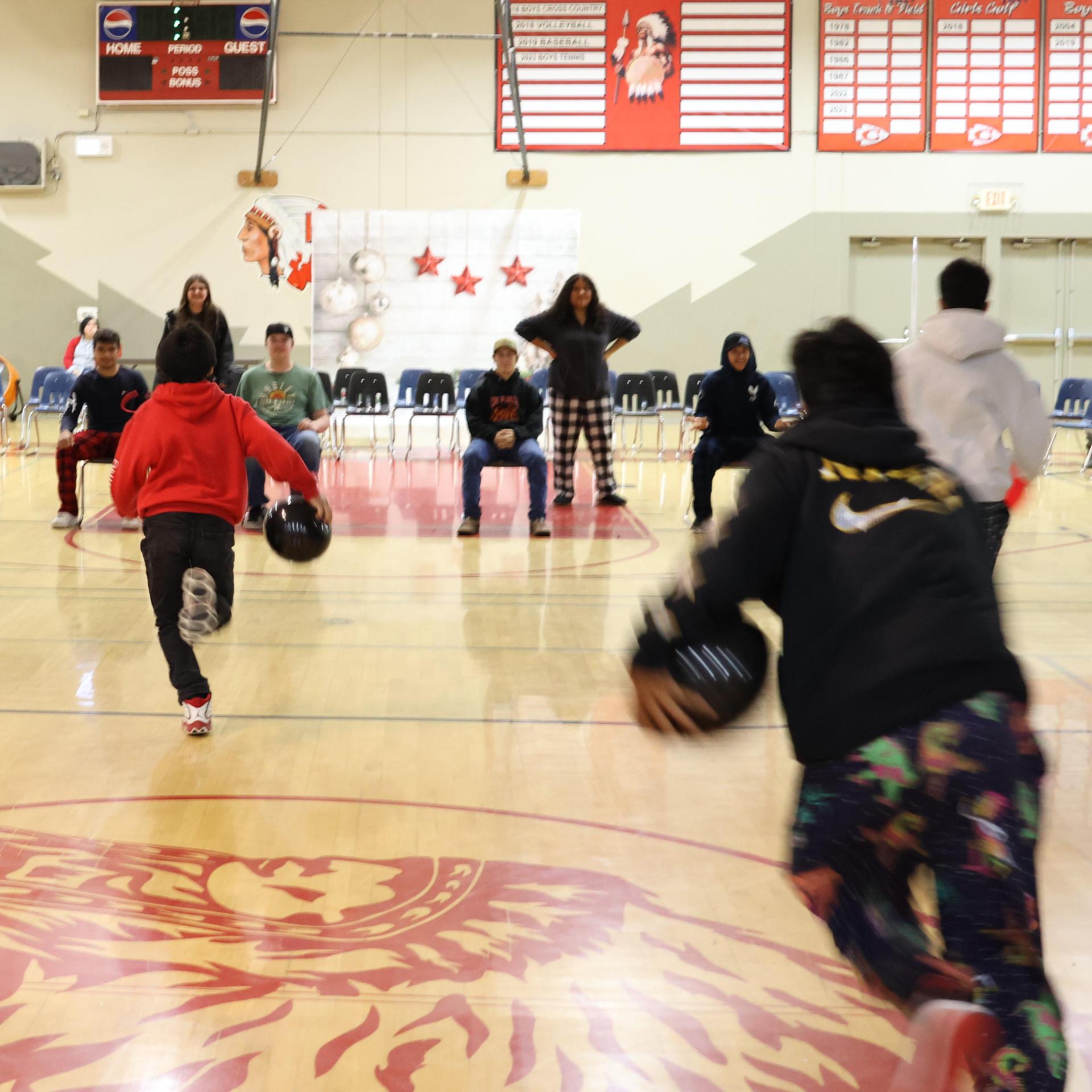 students playing the balloon pop game