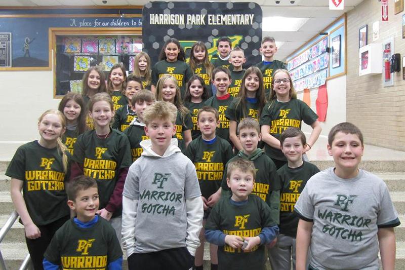 students gathered on the stairs of Harrison Park Elementary