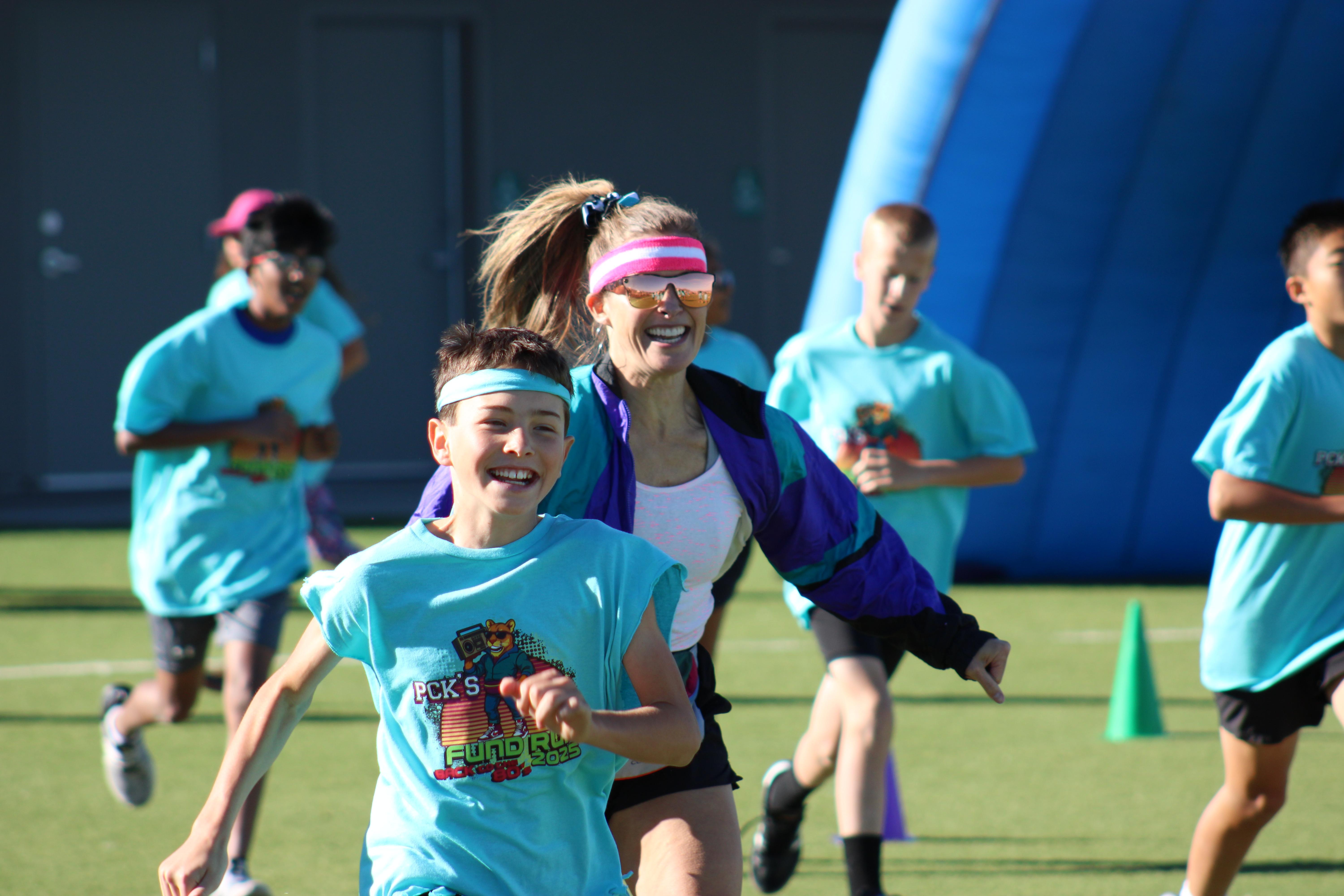 Students and parents race during Fund Run