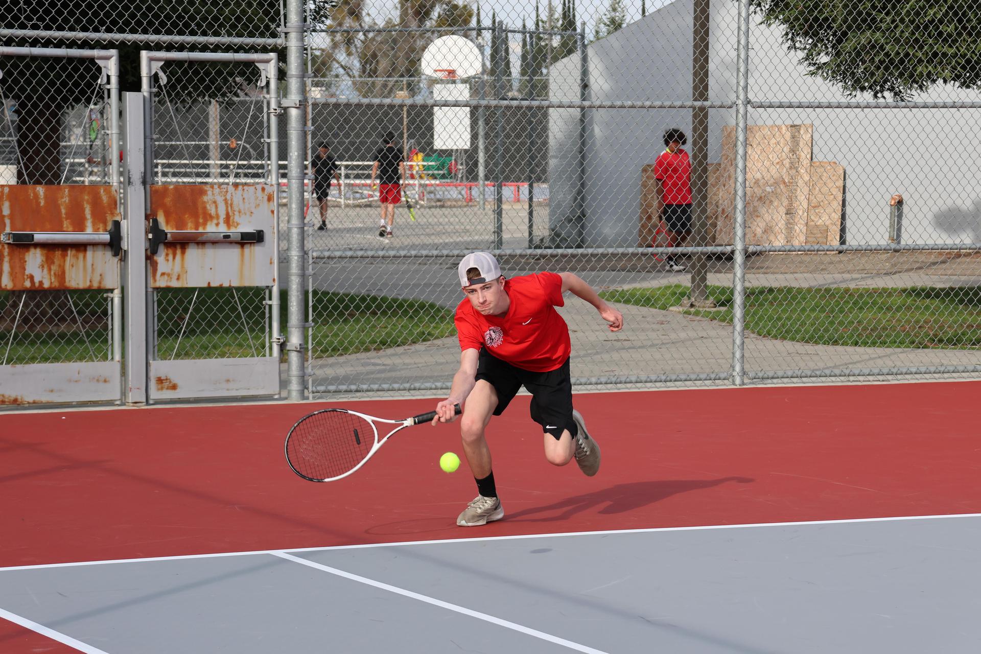 CUHS Boys playing tennis against coalinga