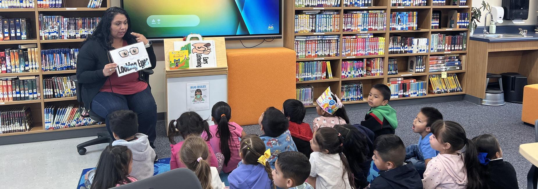 several students paying attention to the librarian