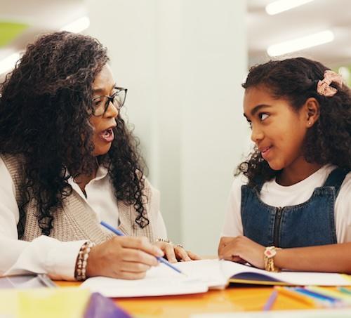 Student focusing on what a teacher is saying