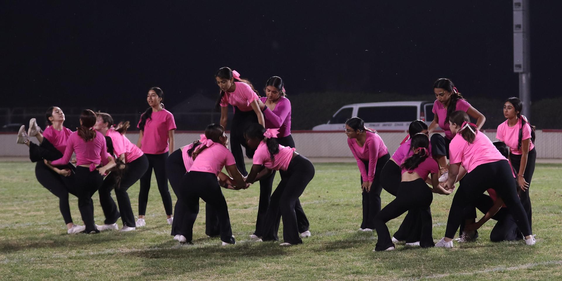 Varsity Cheer performing at halftime vs. Fowler