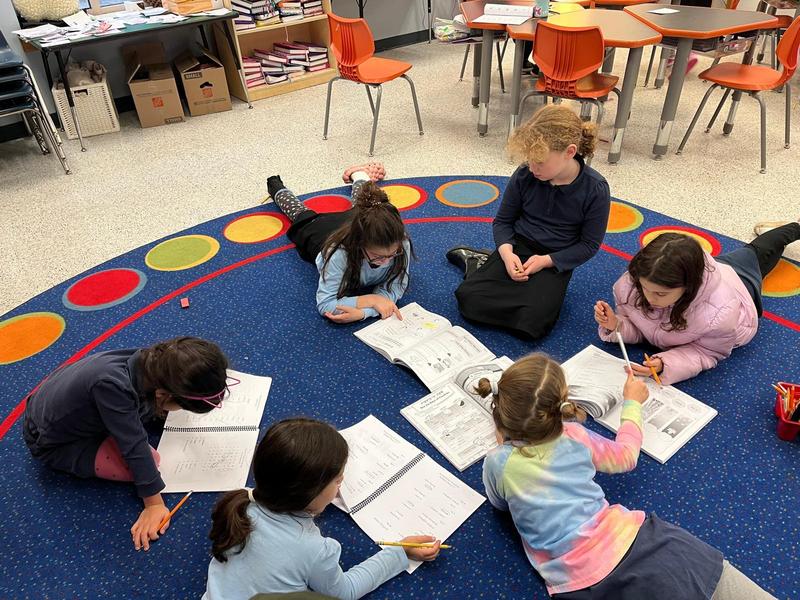 Second Grade girls working on Chumash