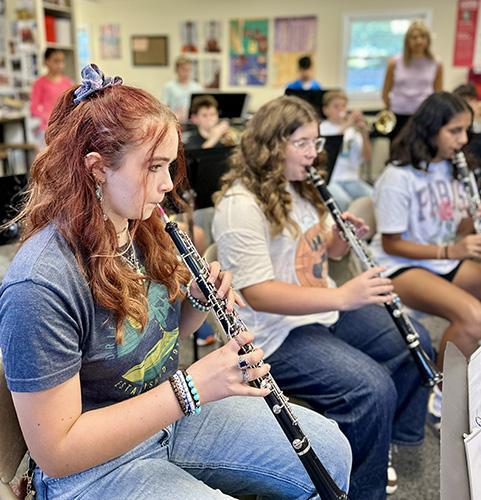 James River Day School orchestra students practicing with their clarinets