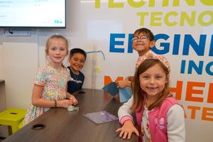 Student group posing with their STEM Lab beanstock creation.