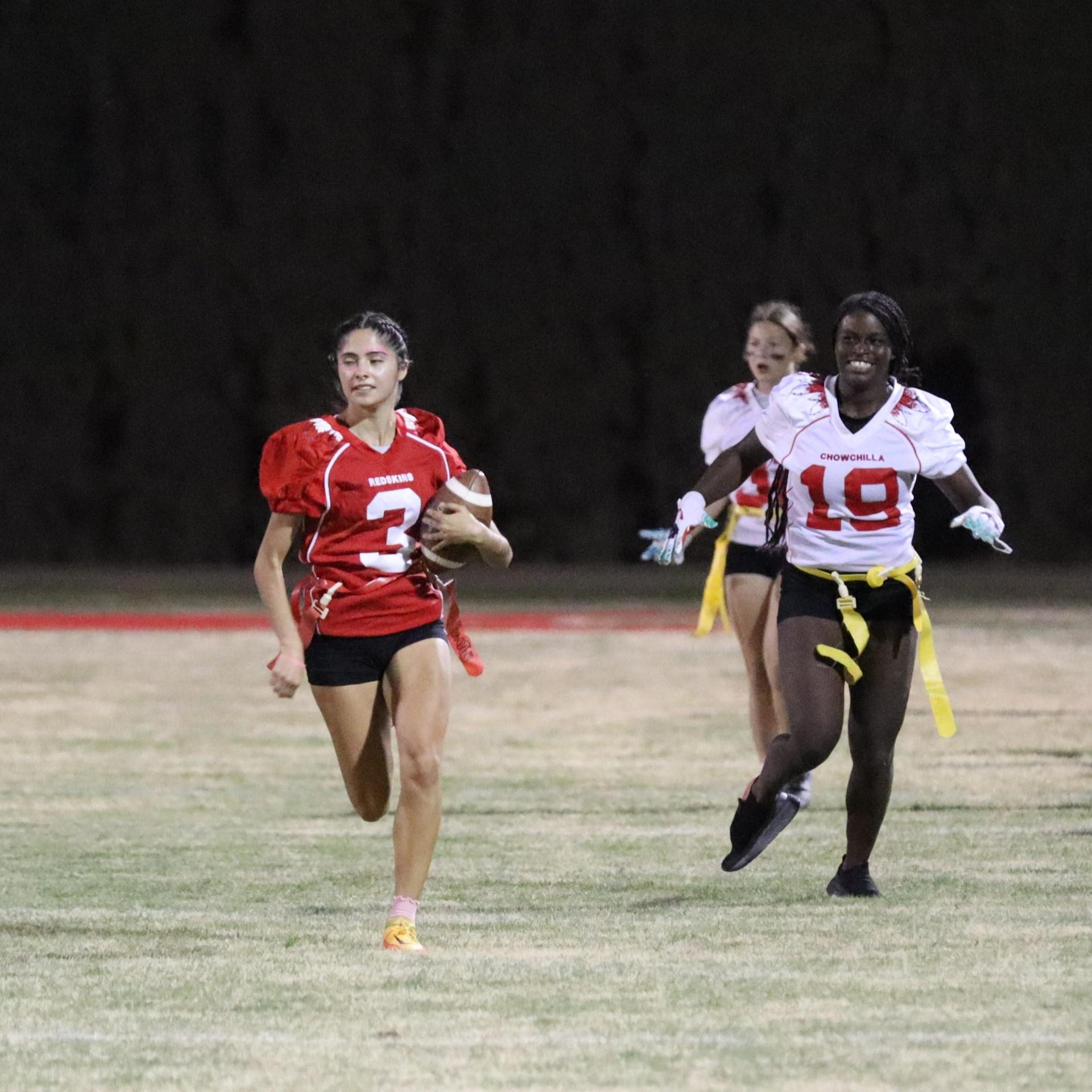 girls playing flag football
