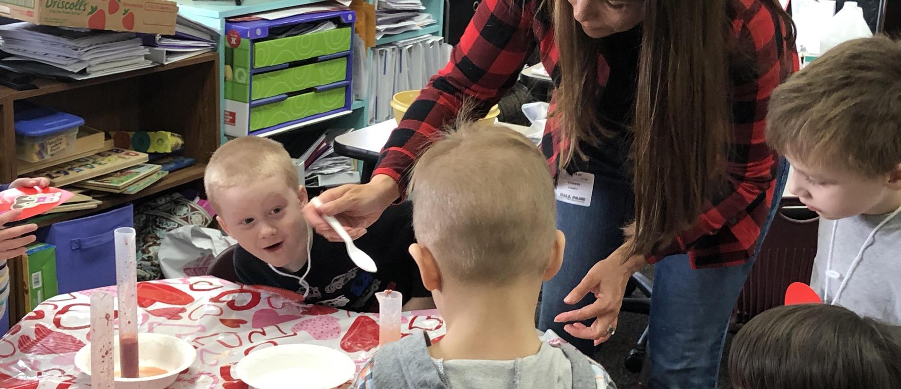 Teacher and students doing an experiment