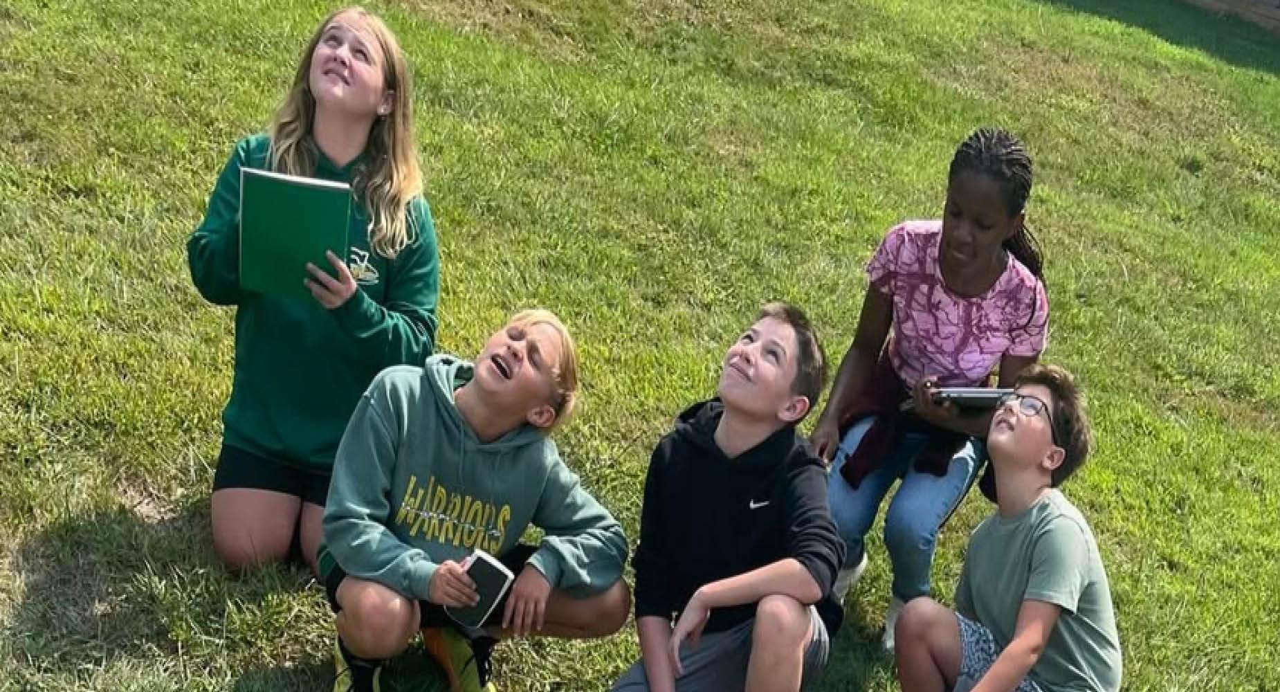 Penn Middle students gaze at the sky during a science project.