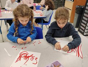 Girls make their name out of twizzlers