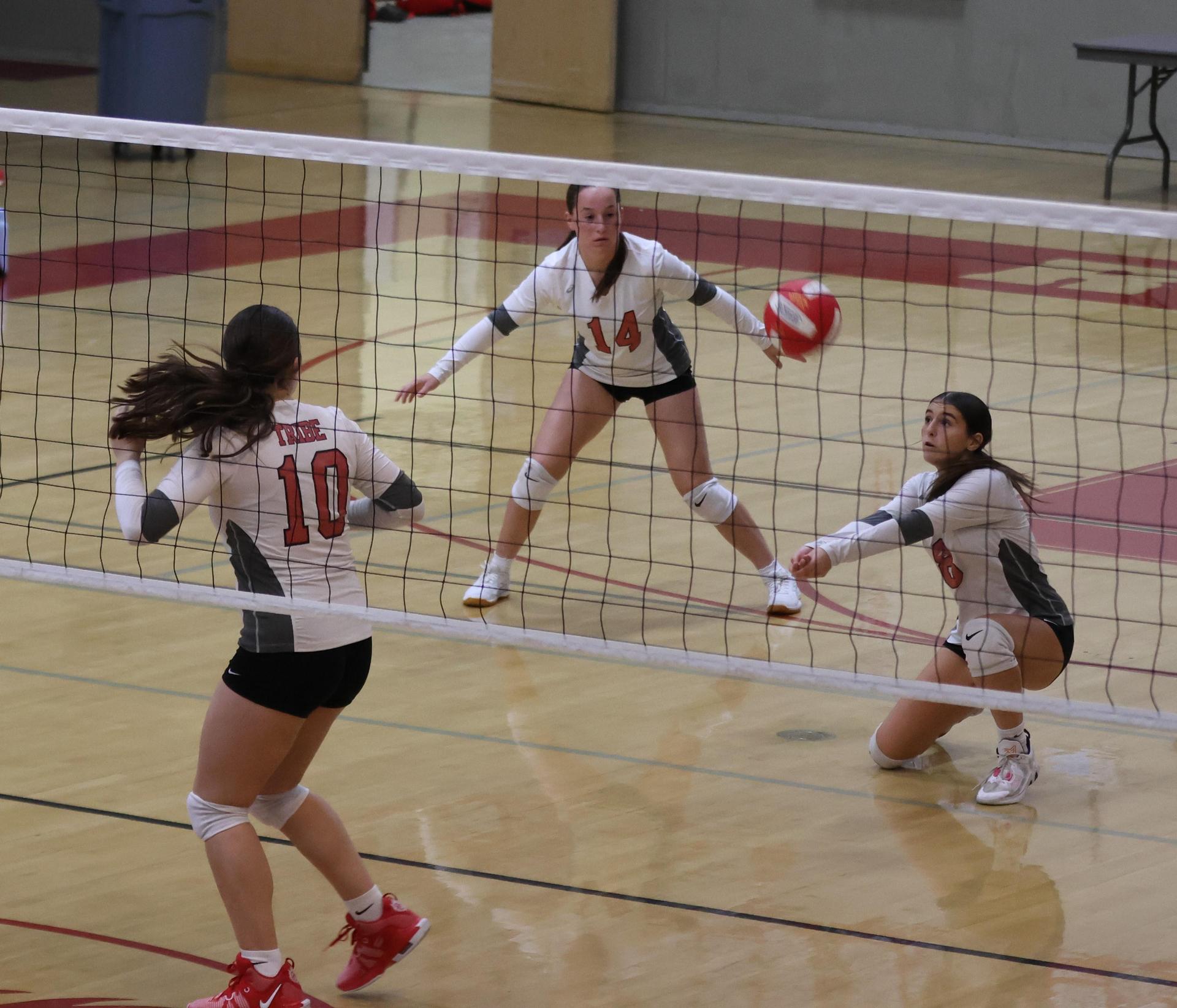 junior varsity girls playing volleyball 92