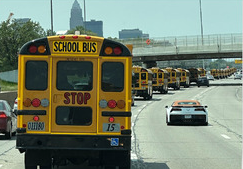 This is a picture of our school buses on the freeway.