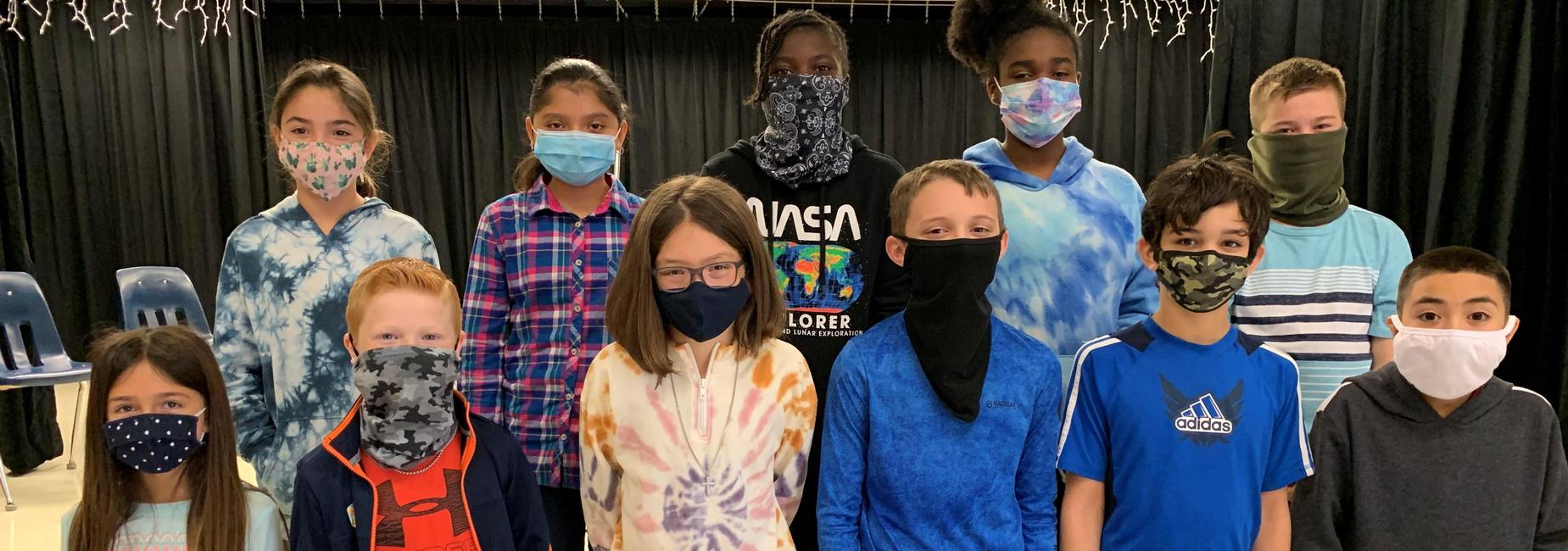 group of kids wearing facemasks