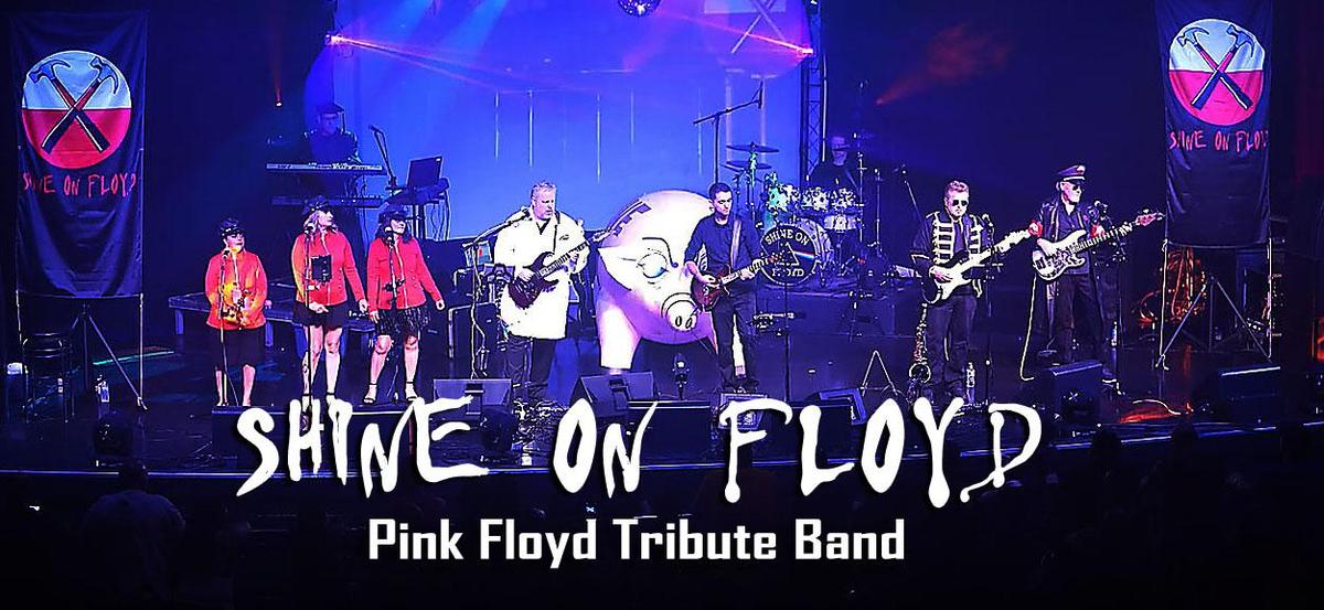 Band members from Shine On Floyd on stage of Marquee Theater. Band members are holding instruments.