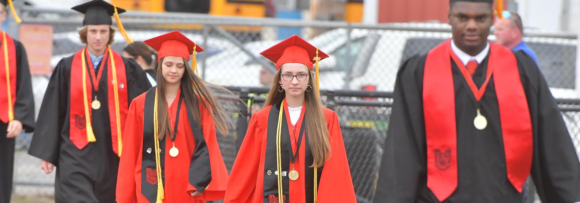 Seniors process into graduation - class president, valedictorian and salutatorian