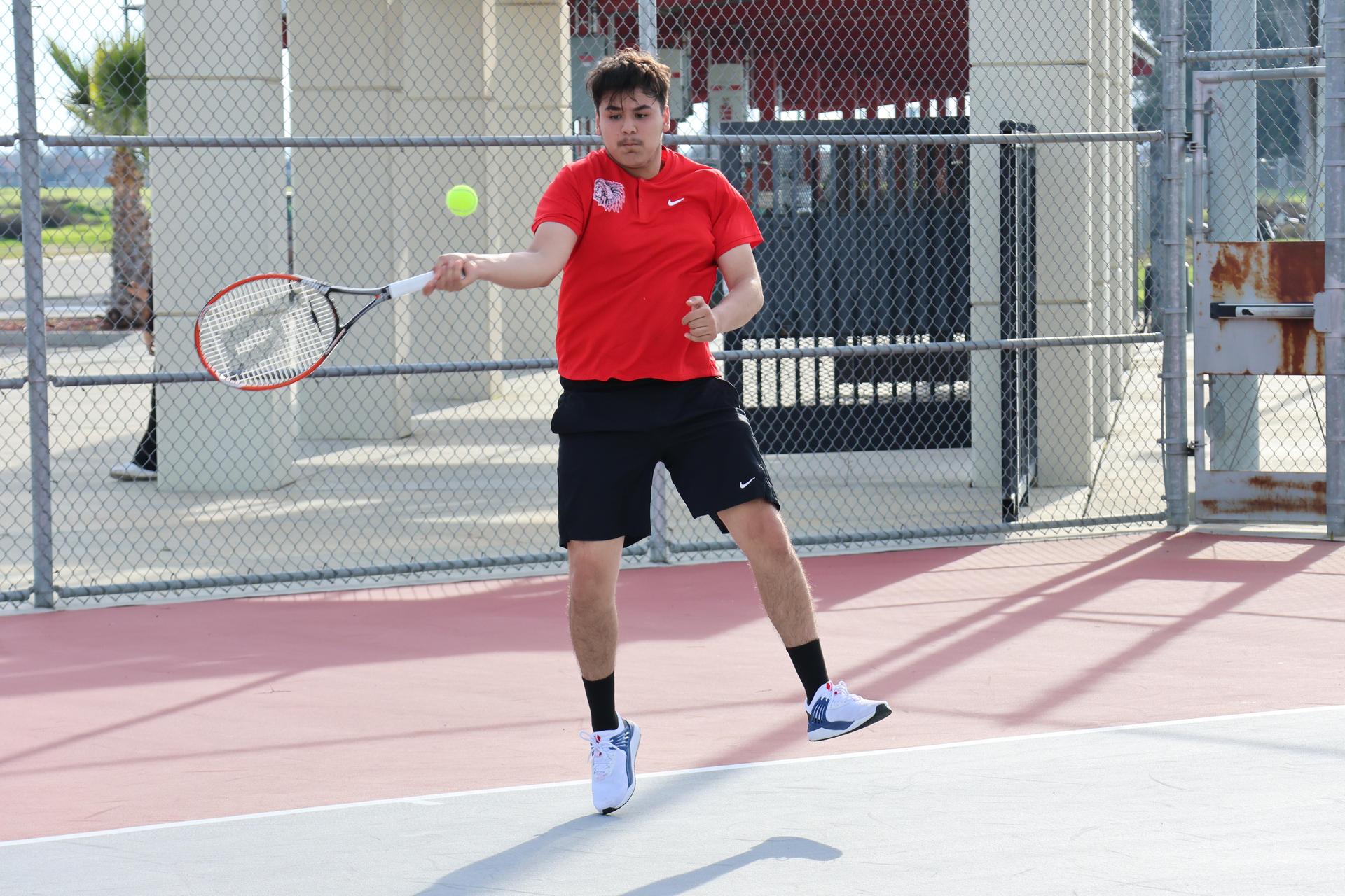 CUHS Boys playing tennis against coalinga