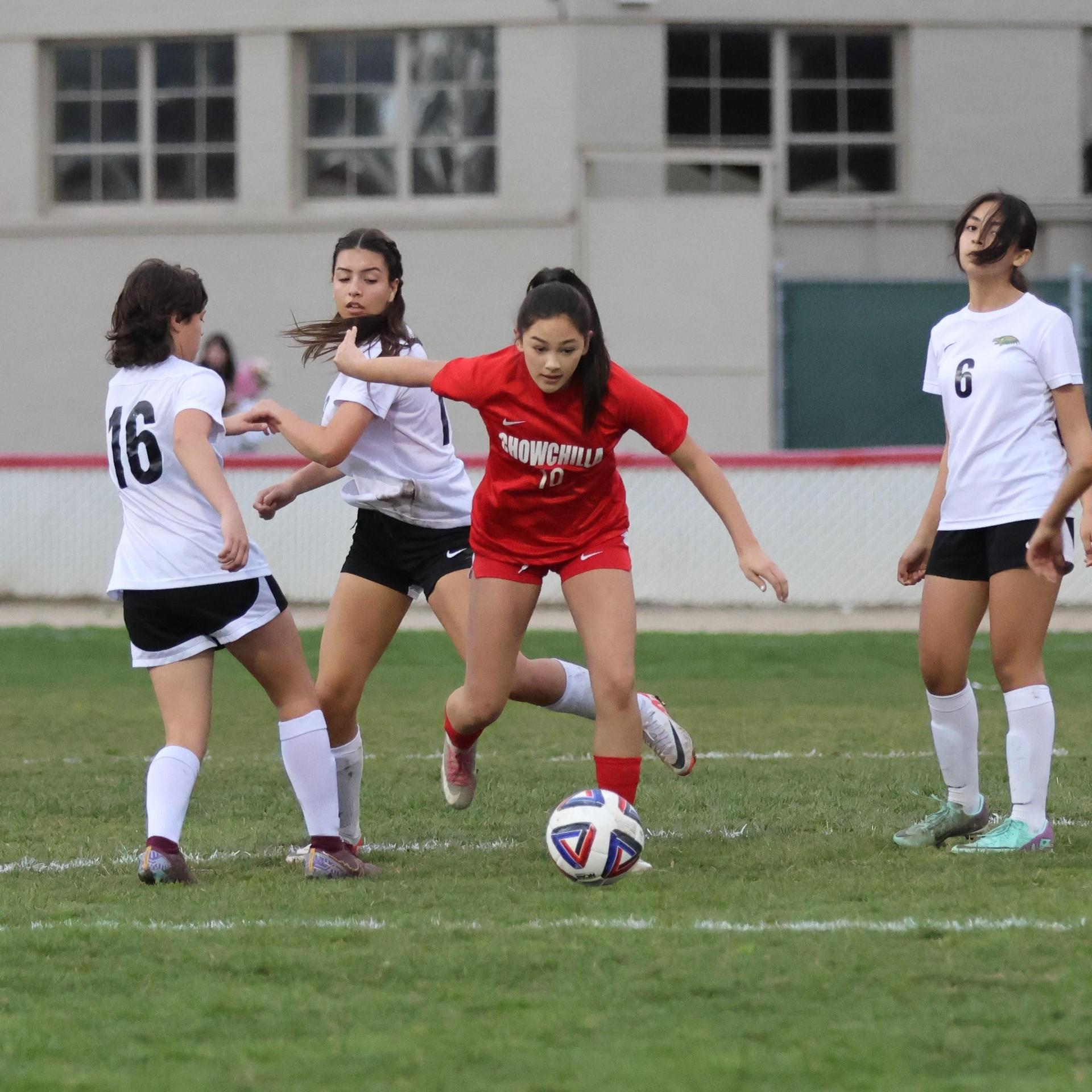 Junior varsity girls playing soccer against liberty