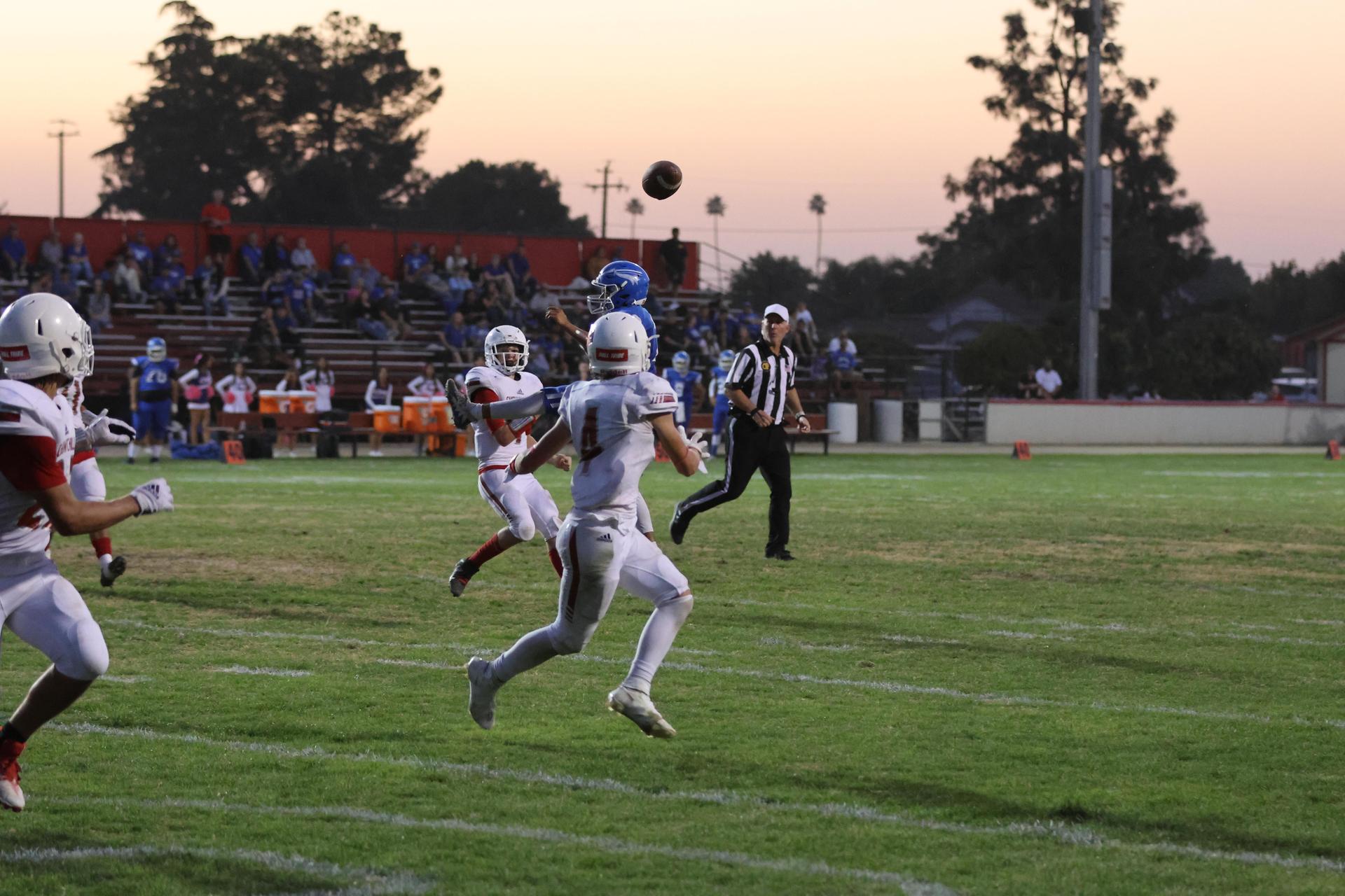 Junior Varsity football players in action against Caruthers