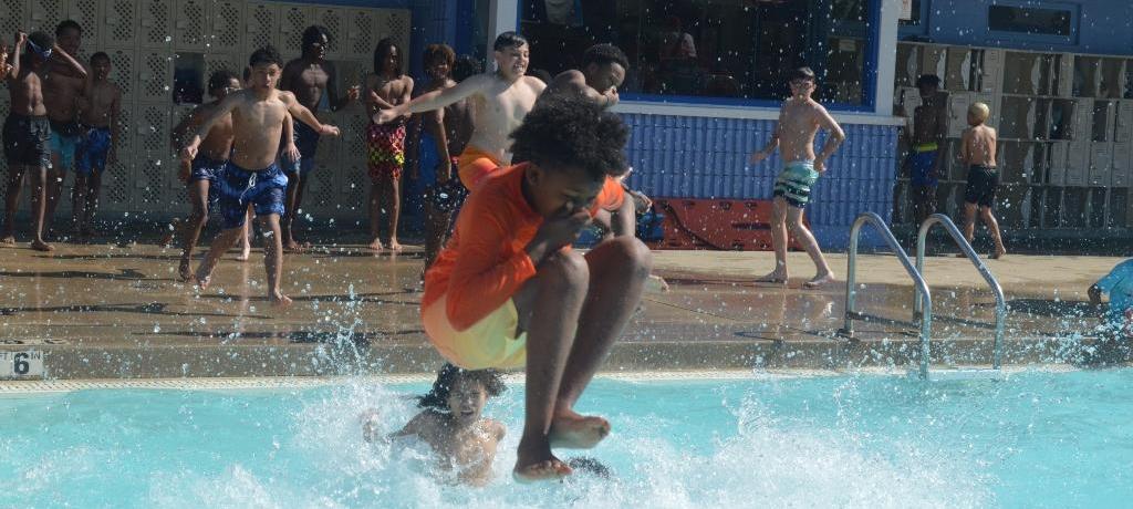 boy "cannonballs" into pool