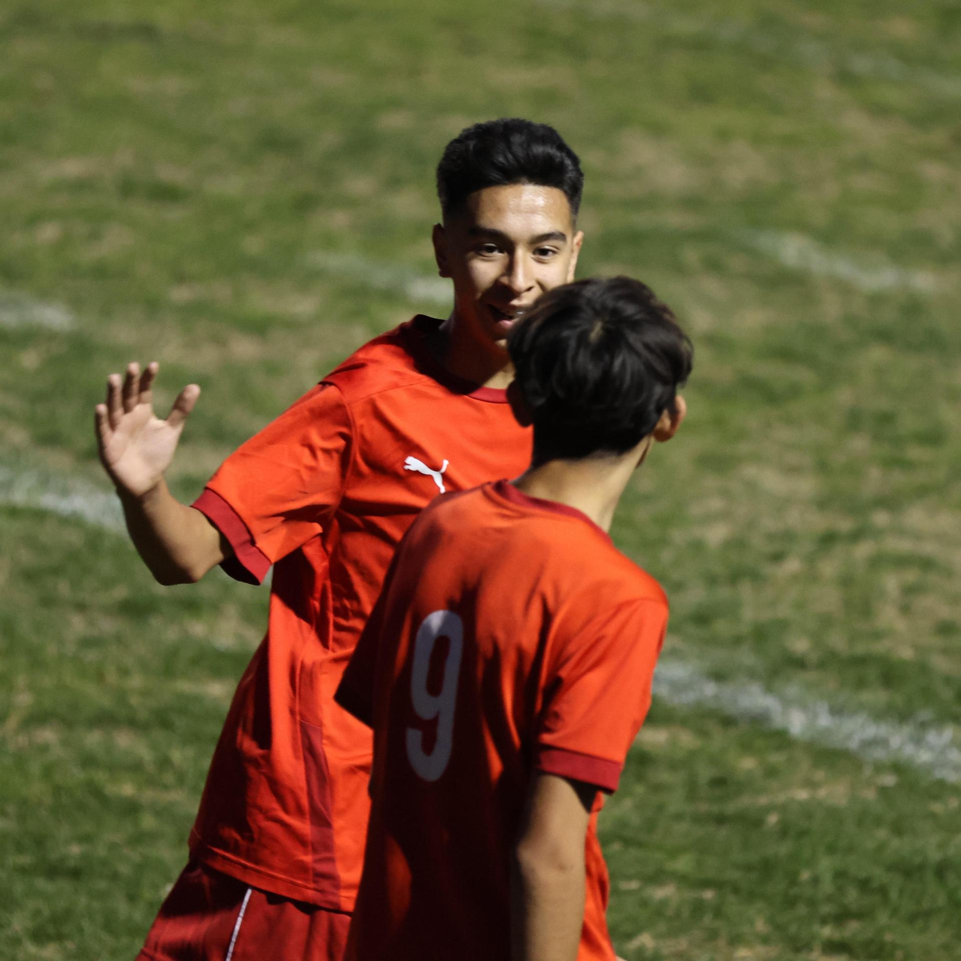 Junior Varisty boys playing soccer against Kingsburg